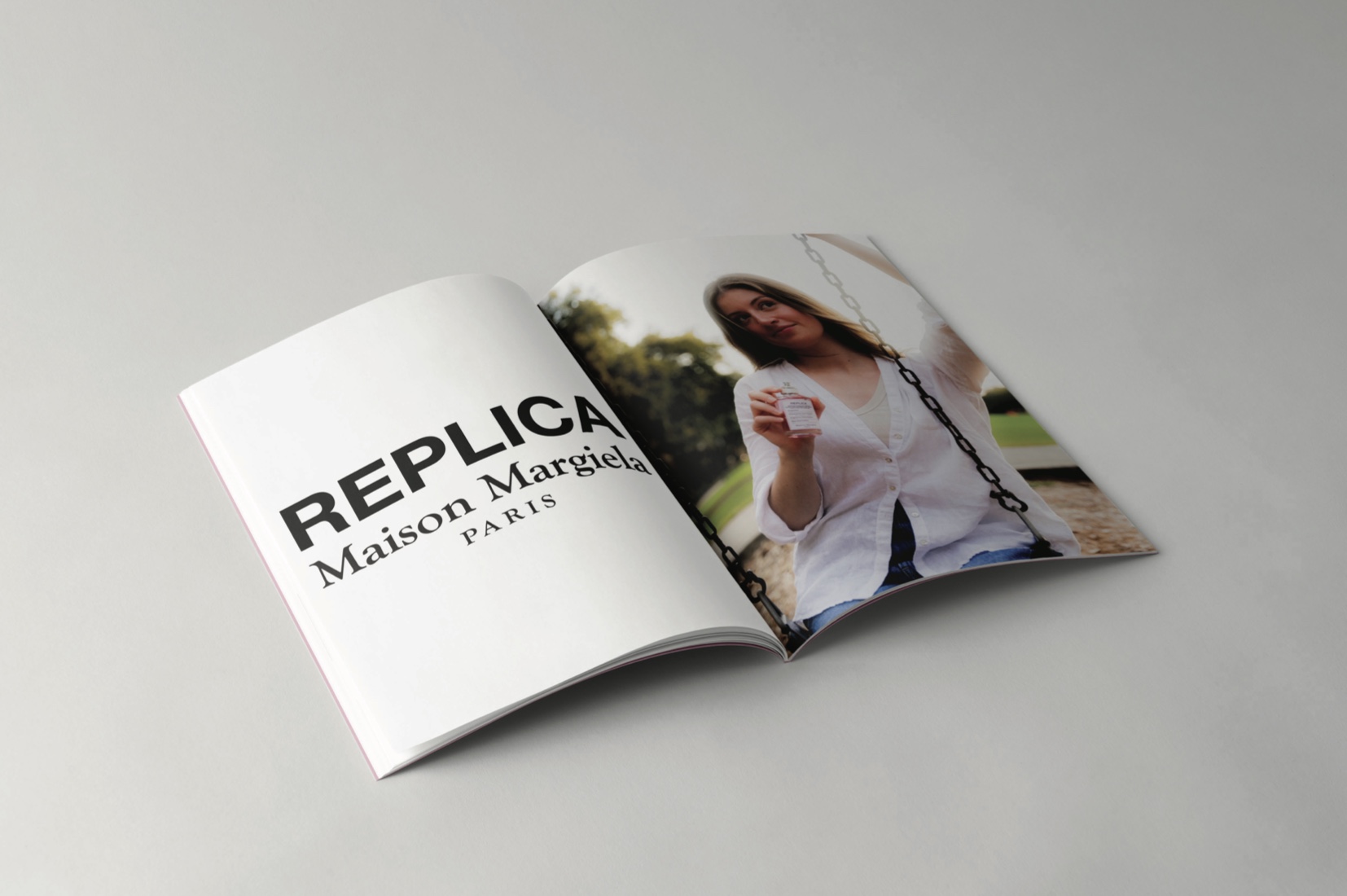 Magazine spread mockup — REPLICA Maison Margiela cover paired with the swing-set portrait