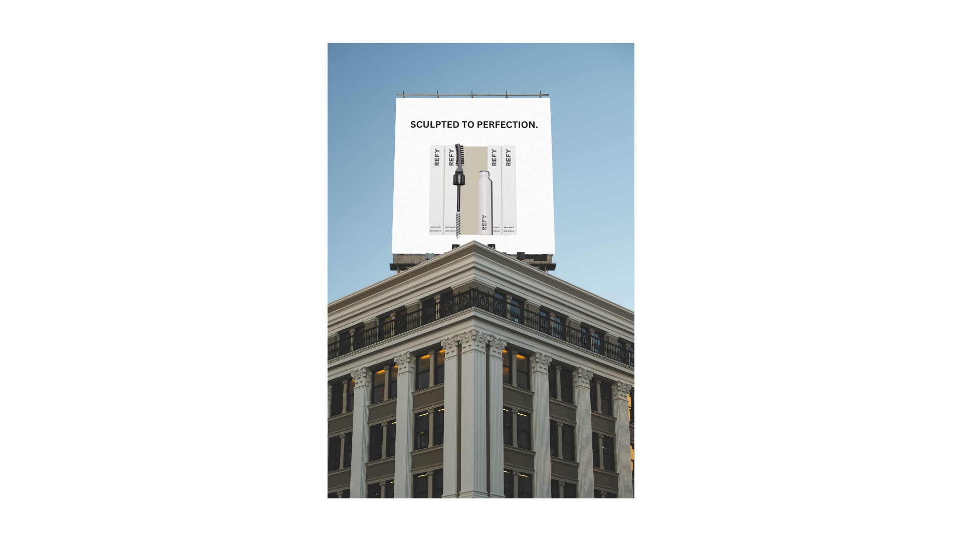 Downtown billboard — 'Sculpted to Perfection' headline mounted above a city street